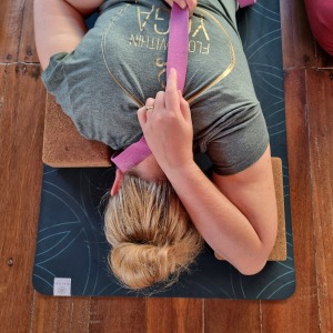 student-in-a-yin-yoga-variation-to-open-the-shoulders-during-our-200-hour-yoga-teacher-training-in-bali