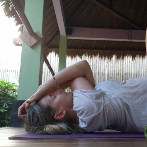 student-demonstrating-yin-yoga-for-the-upper-body-in-our-yin-yoga-teacher-training-50-hour-program-in-bali.