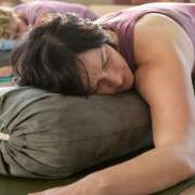 2026 yin yoga and chinese medicine bali with akirayoga a student practicing wide knee child pose in our 2026 yin yoga and chinese medicine teacher training program in nusa lembongan bali with akirayoga