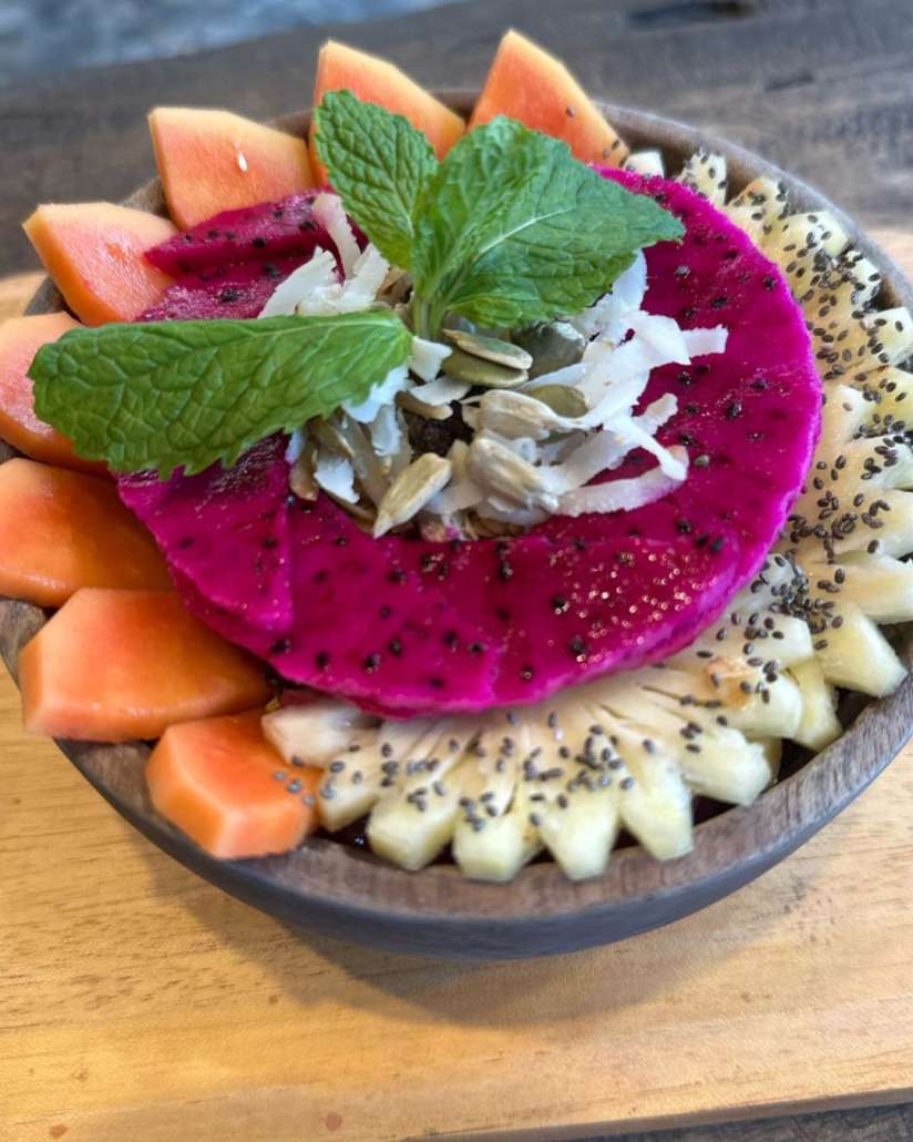 Community breakfast served in a yoga shala on Nusa Lembongan, reflecting local collaboration and shared retreat experiences in Bali